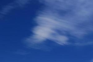 Clear blue sky and white clouds photo