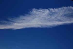 Clear blue sky and white clouds photo