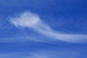 Clear blue sky and white clouds photo