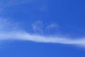 Clear blue sky and white clouds photo