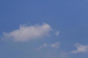 Clear blue sky and white clouds photo