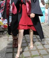 university graduating students are having a photo shooting in the park