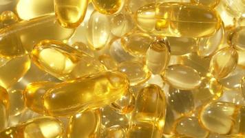 vitamines d, capsules omega 3, macro video