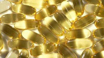 vitamines d, capsules omega 3, macro video