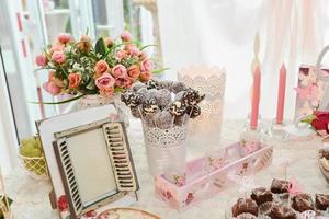 sweets and cookies arranged on the table for wedding reception photo