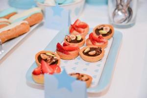 delicious sweets arranged on the table for event reception photo