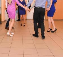 People dancing at the wedding party. focus on legs photo