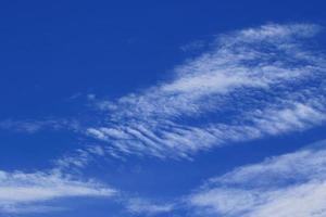 Clear blue sky and white clouds photo