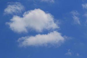 Clear blue sky and white clouds photo