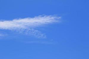 Clear blue sky and white clouds photo