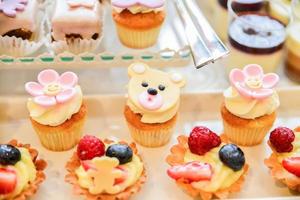 delicious sweets arranged on the table for event reception photo