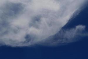 Clear blue sky and white clouds photo