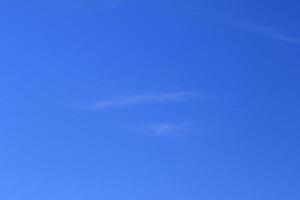 Clear blue sky and white clouds photo