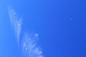 Clear blue sky and white clouds photo