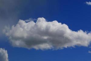 Clear blue sky and white clouds photo