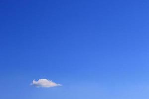 Clear blue sky and white clouds photo