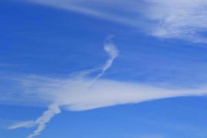 Clear blue sky and white clouds photo