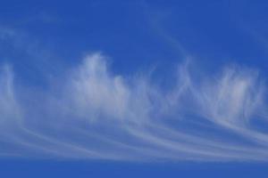 Clear blue sky and white clouds photo