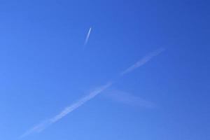 Clear blue sky and white clouds photo