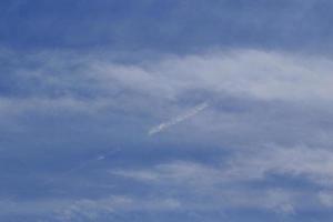 Clear blue sky and white clouds photo