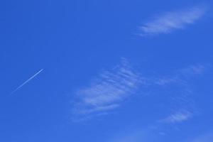 Clear blue sky and white clouds photo