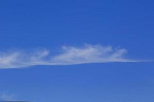 Clear blue sky and white clouds photo