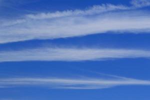 Clear blue sky and white clouds photo