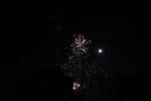 Colorful fireworks on the black sky photo