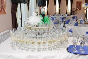 wedding champagne glasses arranged on the table photo