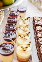 delicious sweets arranged on the table for event reception photo