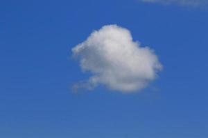 Clear blue sky and white clouds photo