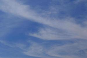 Clear blue sky and white clouds photo