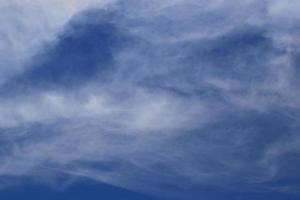 Clear blue sky and white clouds photo