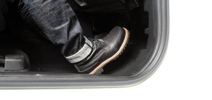 Close up foot press or push foot break and accelerate pedal of a car to drive ahead. photo