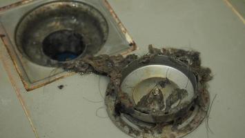 Drain cleaning Clogged and dirty sewer pipes floor drain. photo