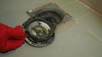 Drain cleaning Clogged and dirty sewer pipes floor drain. photo