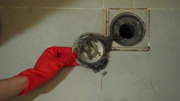 Drain cleaning Clogged and dirty sewer pipes floor drain. photo