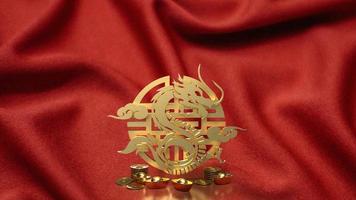 The gold Chinese money and dragon zodiac for 2024 year 3d rendering photo