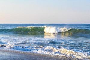 Extremely huge big surfer waves at beach Puerto Escondido Mexico. photo