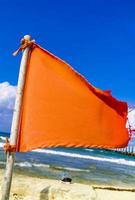 Red flag swimming prohibited high waves Playa del Carmen Mexico. photo