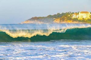 Extremely huge big surfer waves at beach Puerto Escondido Mexico. photo