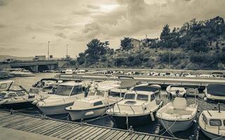 Beach at the marina beach boats promenade Novi Vinodolski Croatia. photo