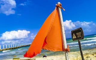 Red flag swimming prohibited high waves Playa del Carmen Mexico. photo