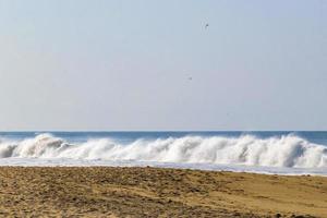 Extremely huge big surfer waves at beach Puerto Escondido Mexico. photo