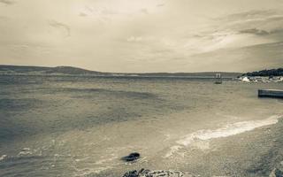 Wonderful sand and rocky beach and promenade Novi Vinodolski Croatia. photo