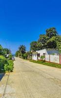 Busy road street driving cars traffic jam Puerto Escondido Mexico. photo