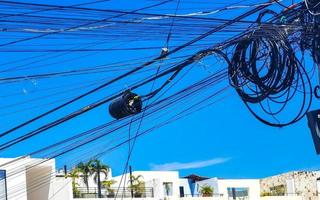 Absolute cable chaos on Thai power pole in Mexico. photo