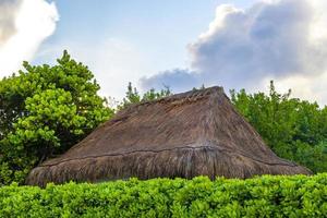 Palapa roof resort in tropical beach Playa del Carmen Mexico. photo