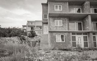 Old abandoned unfinished construction house building in Novi Vinodolski Croatia. photo