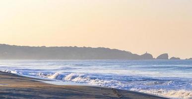 Extremely huge big surfer waves beach La Punta Zicatela Mexico. photo